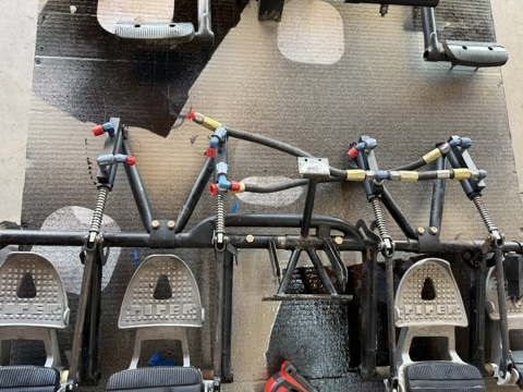 Assembled dual toe brake linkage with hydraulic fittings